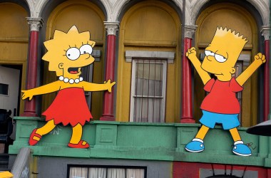 Lisa Simpson and Bart Simpson cut-outs on display at a block party in Los Angeles, California.