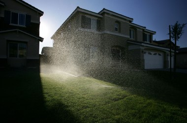 Sprinklers water the lawns of a new housing development July 28th, 2005, in Hesperia, California.