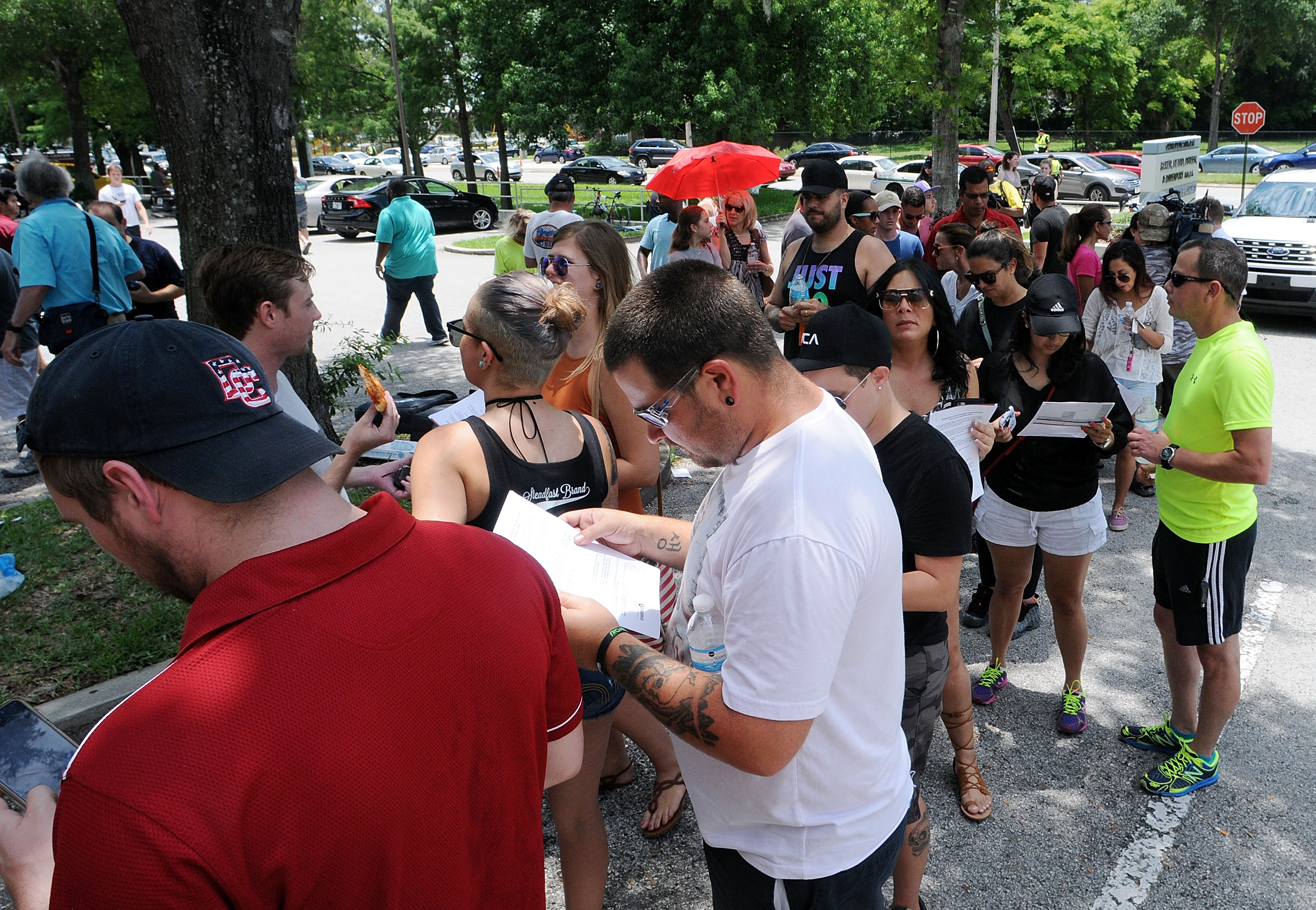 Long lines of people wait at the OneBlood Donation Center to donate blood for the injured victims of the Pulse nightclub shooting on June 12th, 2016, in Orlando, Florida.