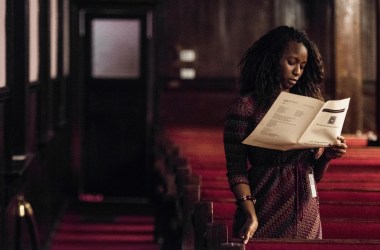 A woman reads a program during a memorial service honoring the victims of the mass shooting at Emanuel African Methodist Episcopal Church, a year after the massacre, on June 17th, 2016, in Charleston, South Carolina.