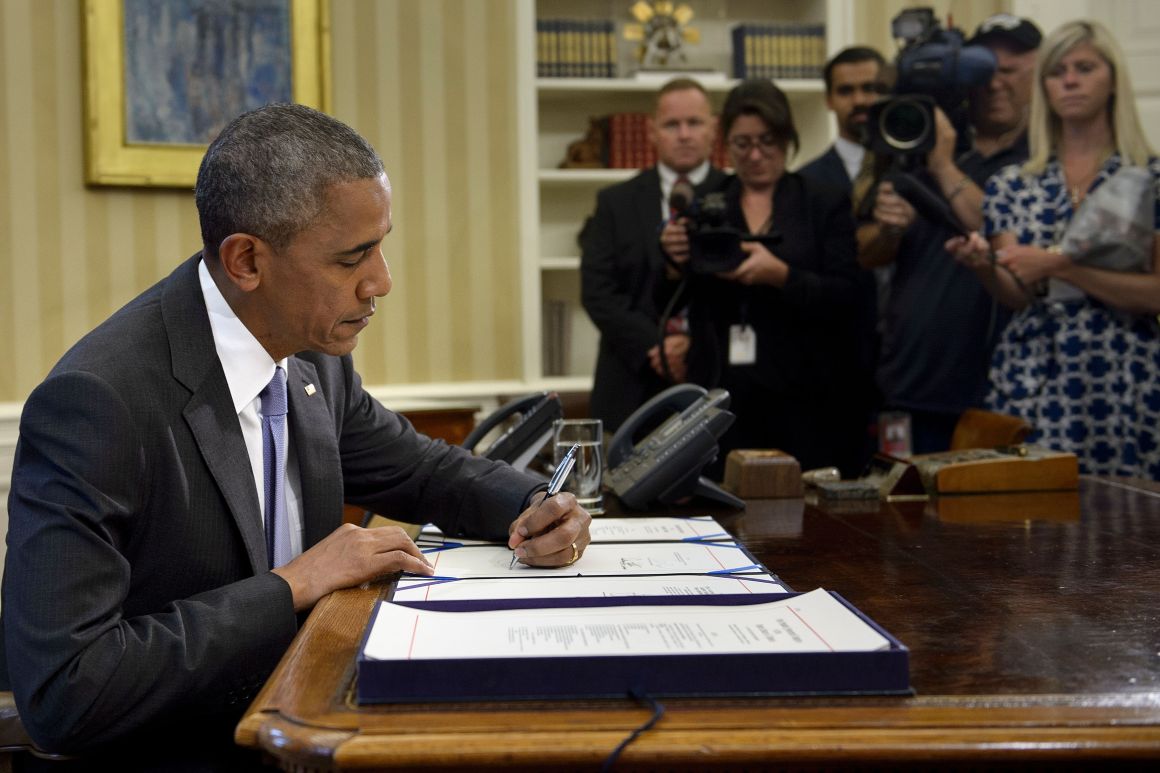 Barack Obama signs the Freedom of Information Improvement Act into law in the Oval Office of the White House on June 30th, 2016, in Washington, D.C.