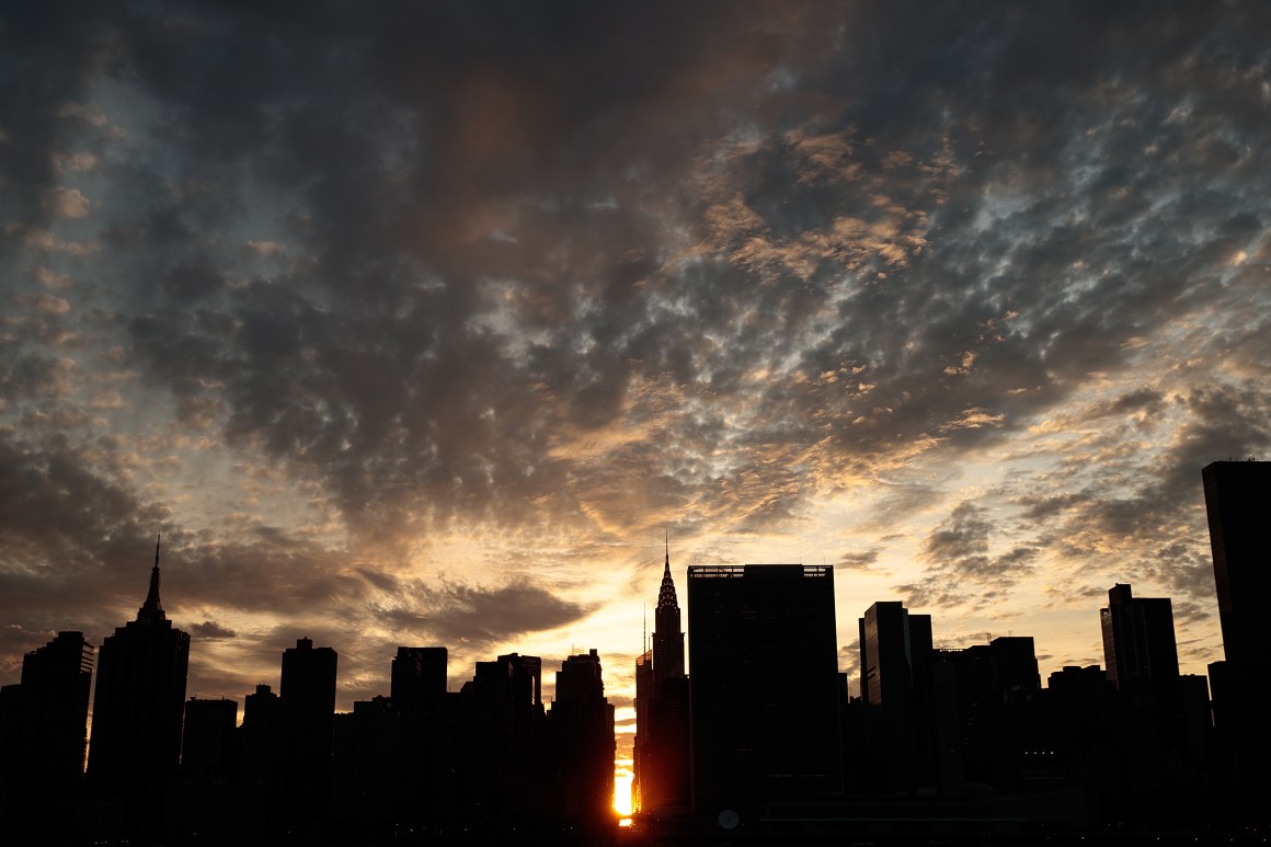 A view of the Manhattanhenge sunset from Hunters Point South Park on July 11th, 2016, in the Queens borough of New York City.