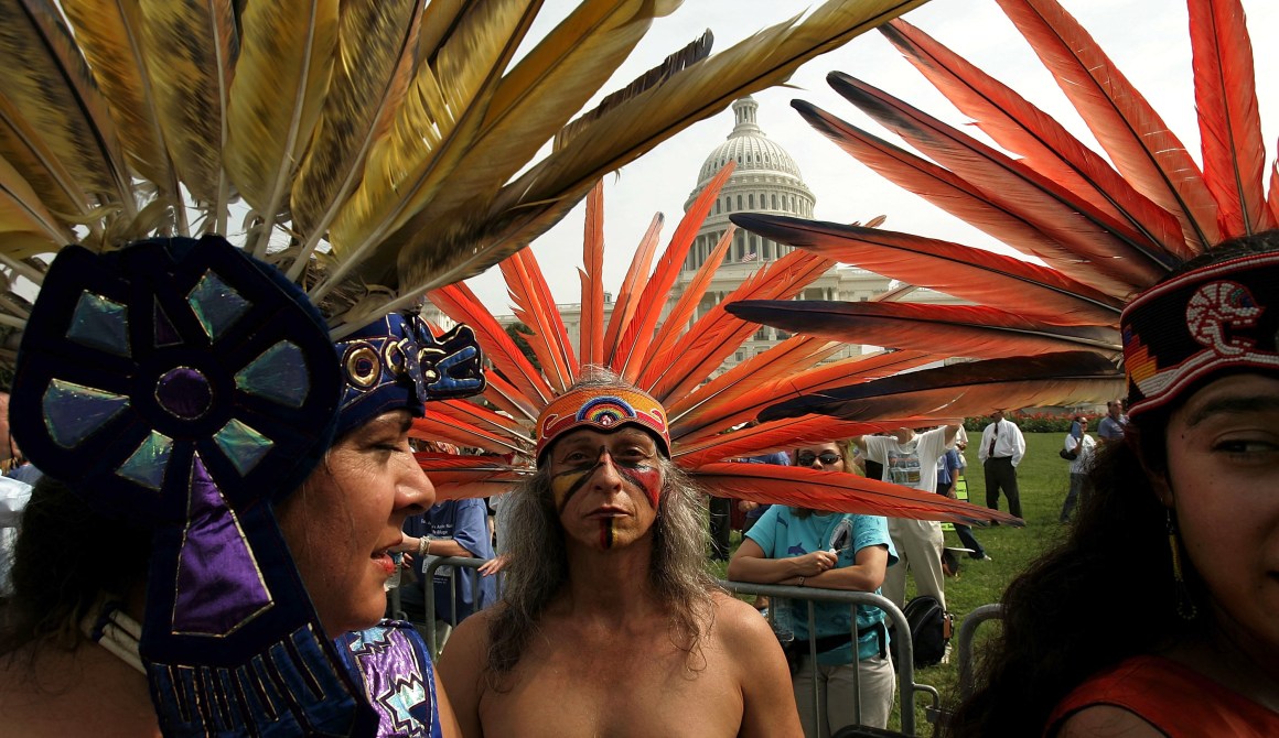 A member of an indigenous tribe in Mexico prepares to perform a traditional dance outside the U.S. Capitol with several hundred other protesters on hand to urge Congress to keep the Arctic National Wildlife Refuge off-limits to oil drilling.