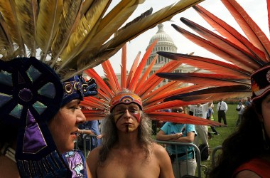 A member of an indigenous tribe in Mexico prepares to perform a traditional dance outside the U.S. Capitol with several hundred other protesters on hand to urge Congress to keep the Arctic National Wildlife Refuge off-limits to oil drilling.