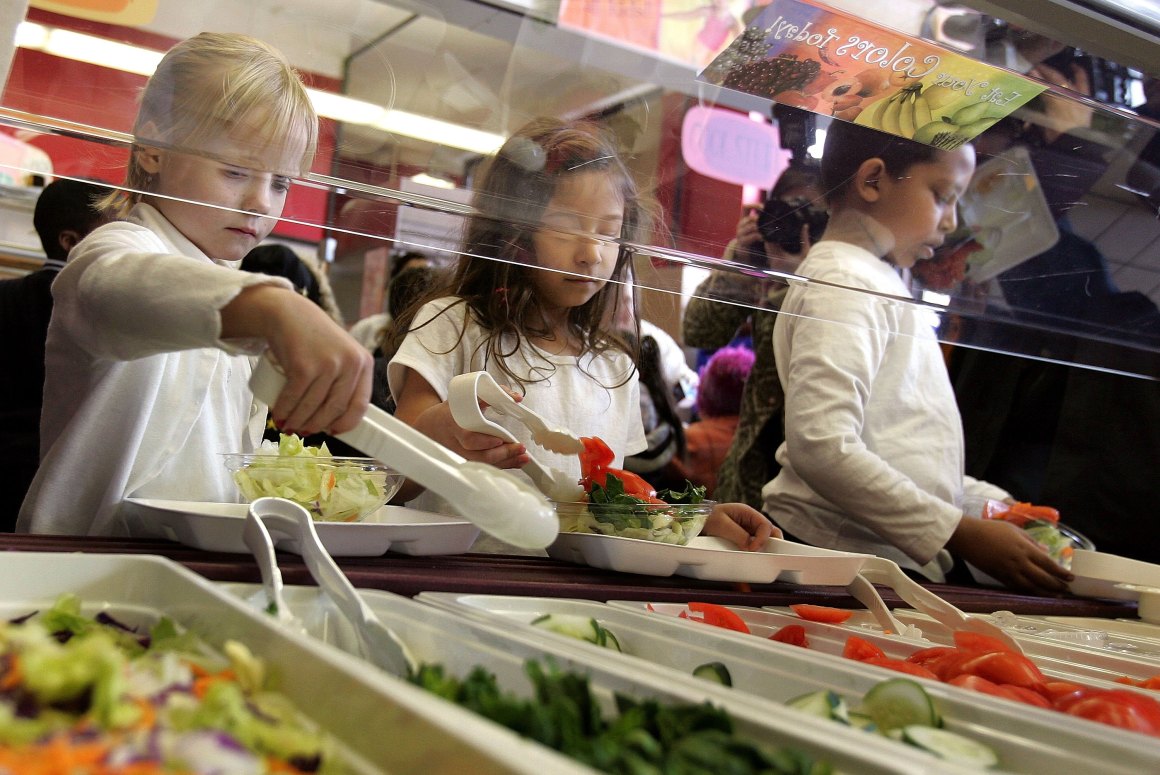 Students at Nettelhorst Elementary School dig into a salad bar in the school's lunchroom on March 20th, 2006, in Chicago, Illinois.