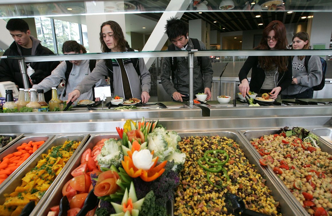 Students at the University of California–Berkeley build salads with organic vegetables at Crossroads dining commons.