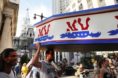 Protesters hold a wooden coffin with an upside down donkey representing the Democratic Party in downtown Philadelphia during the Democratic National Convention on July 26th, 2016, in Philadelphia, Pennsylvania.