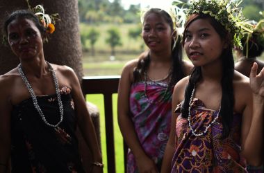 Malaysian women from the indigenous Temiar community standing backstage in traditional costume and headgear before performing during a ceremony to celebrate the International Day of the World's Indigenous Peoples in Shah Alam on the outskirts of Kuala Lumpur.