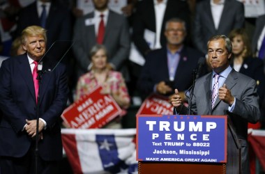 Then-presidential candidate Donald Trump listens to United Kingdom Independence Party leader Nigel Farage during a campaign rally at the Mississippi Coliseum in Jackson, Mississippi, on August 24th, 2016.