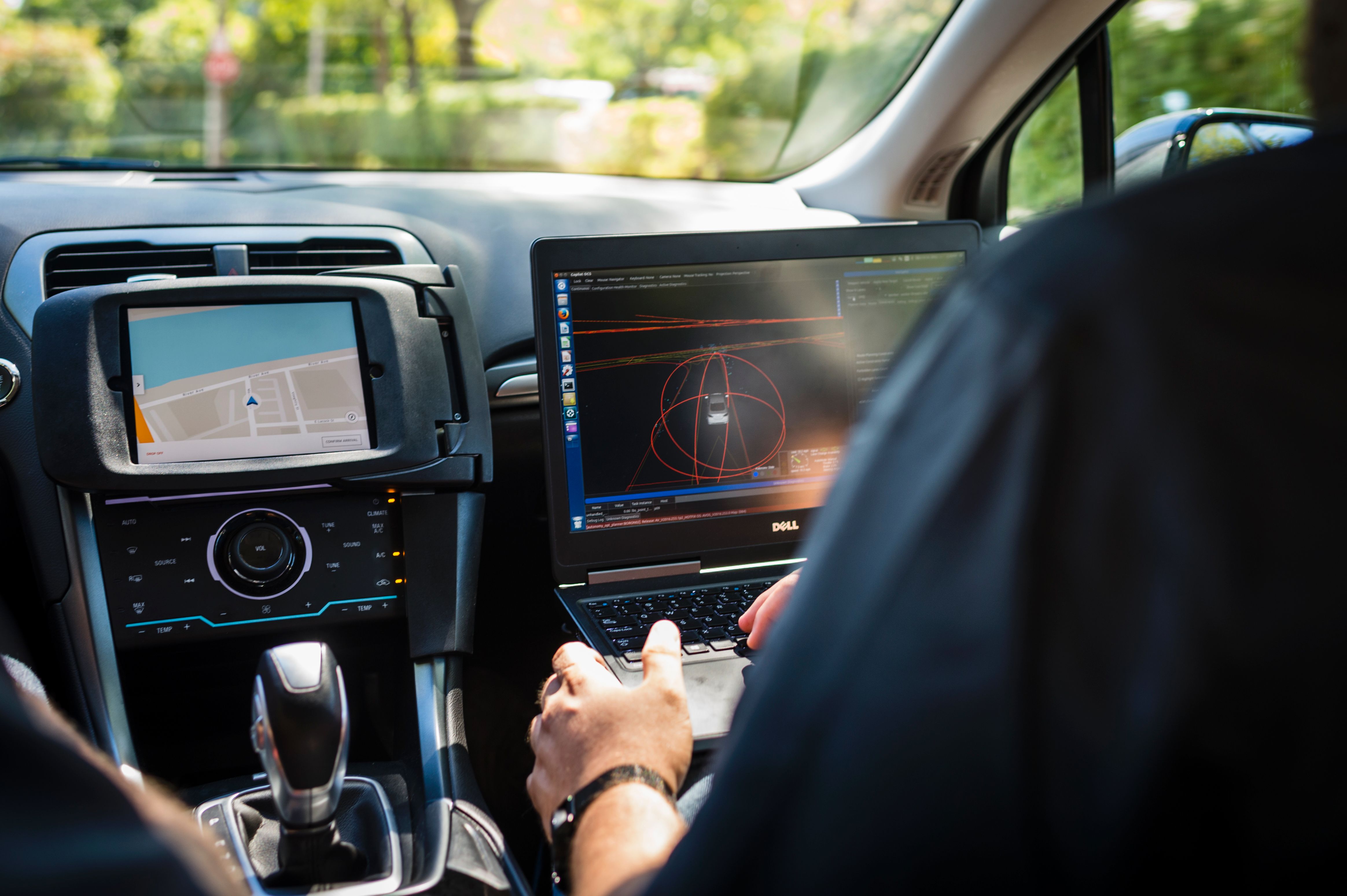 A technician sits in an Uber self-driving car on September 13th, 2016, in Pittsburgh, Pennsylvania.