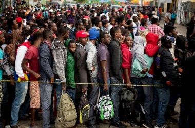 Haitian and African migrants seeking asylum in the United States line up outside a Mexican Migration office on October 3rd, 2016, in Tijuana, Mexico.