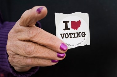 A woman holds her voting sticker in her hand after casting her ballot in Leetonia, Ohio.