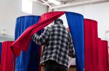 A man casts his vote at Amherst Street Elementary School on November 8th, 2016, in Nashua, New Hampshire.