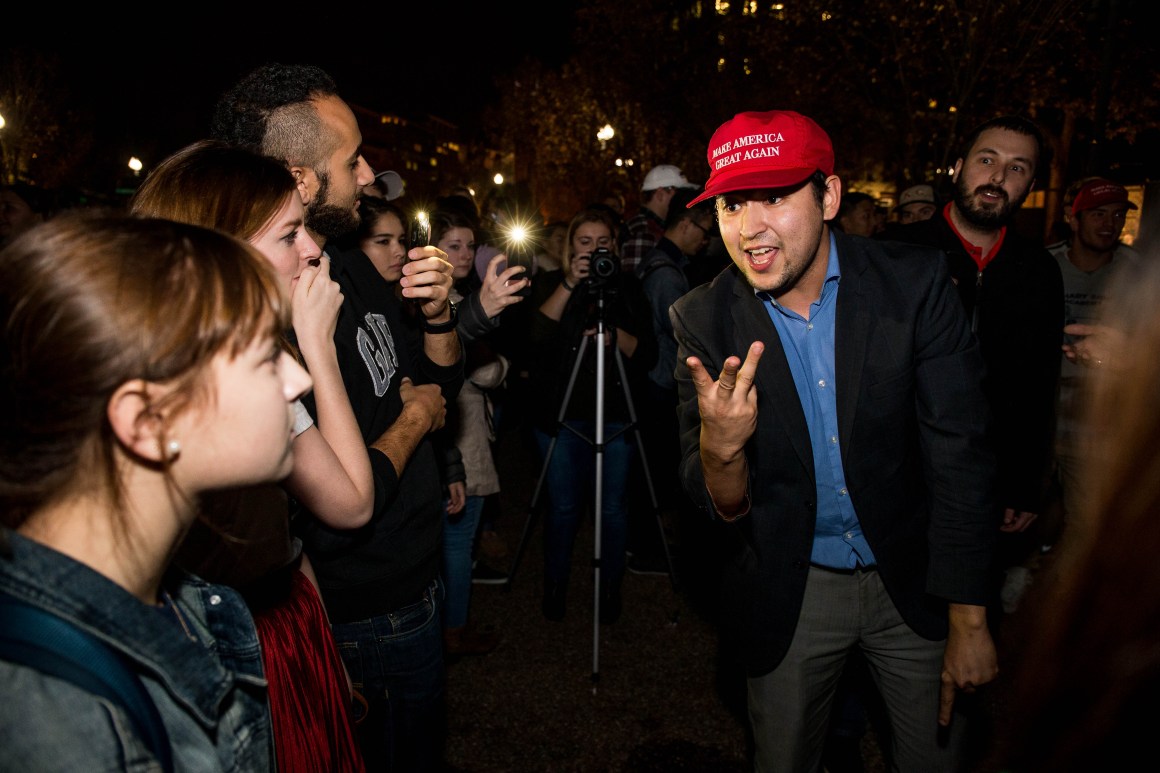 Donald Trump and Hillary Clinton supporters argue in front of the White House while waiting for election results on November 9th, 2016, in Washington, D.C.