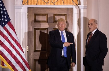 Donald Trump points at U.S. Marine Corps General John Kelly before their meeting at Trump International Golf Club on November 20th, 2016.