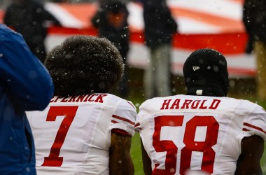 Colin Kaepernick and Eli Harold of the San Francisco 49ers kneel for the national anthem at Soldier Field in Chicago, Illinois, on December 4th, 2016.