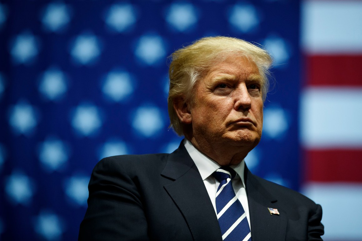 Donald Trump looks on during a rally at the DeltaPlex Arena in Grand Rapids, Michigan.