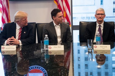 A photo of Donald Trump, Peter Thiel, and Tim Cook.