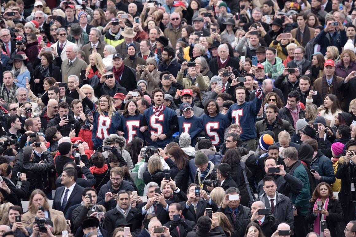 Members of the public chant slogans and display T-shirts during a protest at the beginning of the swearing-in ceremony of Donald Trump in Washington, D.C., on January 20th, 2017.