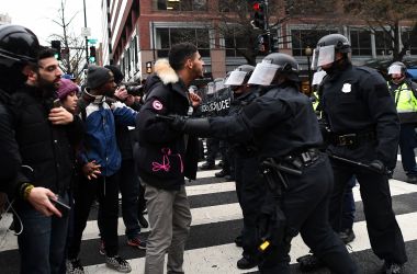 Police officers push back demonstrators as they protest against President Donald Trump in Washington, D.C., on January 20th, 2017.