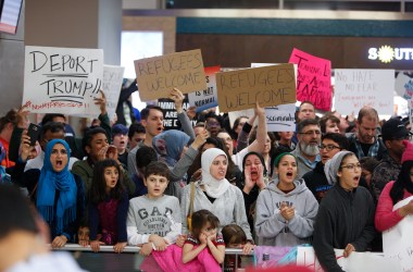 Protesters gather to denounce President Donald Trump's executive order that bans certain immigration, at Dallas-Fort Worth International Airport, on January 28th, 2017 in Dallas, Texas.