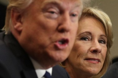 President Donald Trump speaks as Secretary of Education Betsy DeVos listens during a parent-teacher conference at the Roosevelt Room of the White House on February 14th, 2017.