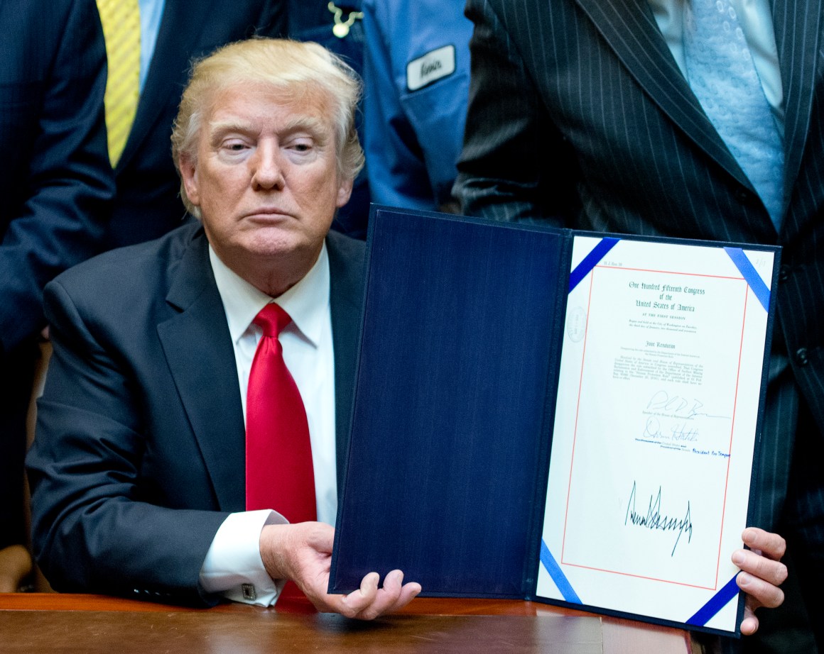 U.S. President Donald Trump signs H.J. Res. 38, disapproving the rule submitted by the U.S. Department of the Interior known as the Stream Protection Rule in the Roosevelt Room of the White House on February 16th, 2017, in Washington, DC.