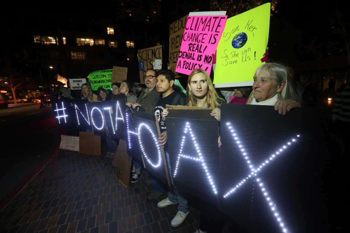 Protesters display signs during a rally against climate skepticism in San Diego, California, on February 21st, 2017.