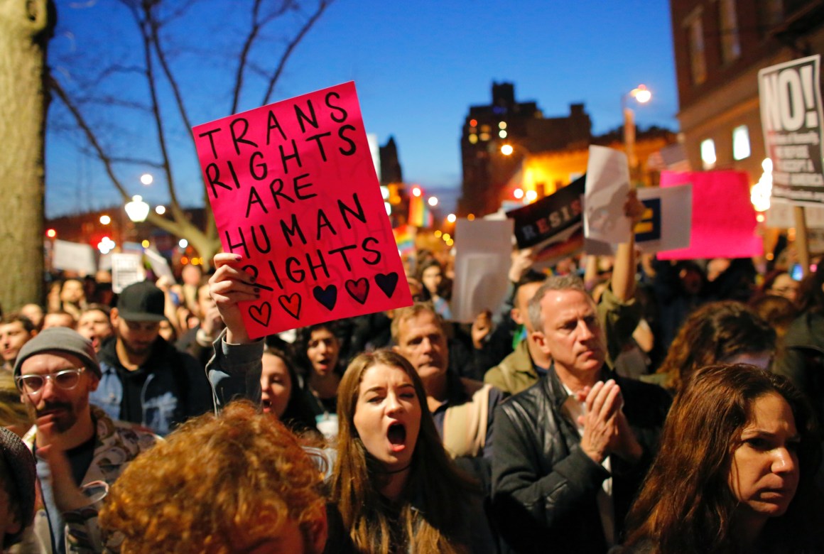 People take part in a rally for trans rights outside the Stonewall Inn in February of 2017.