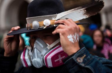 An activist adjusts his hat while protesting the Keystone XL Pipeline during the Native Nations Rise protest on March 10th, 2017, in Washington, D.C.