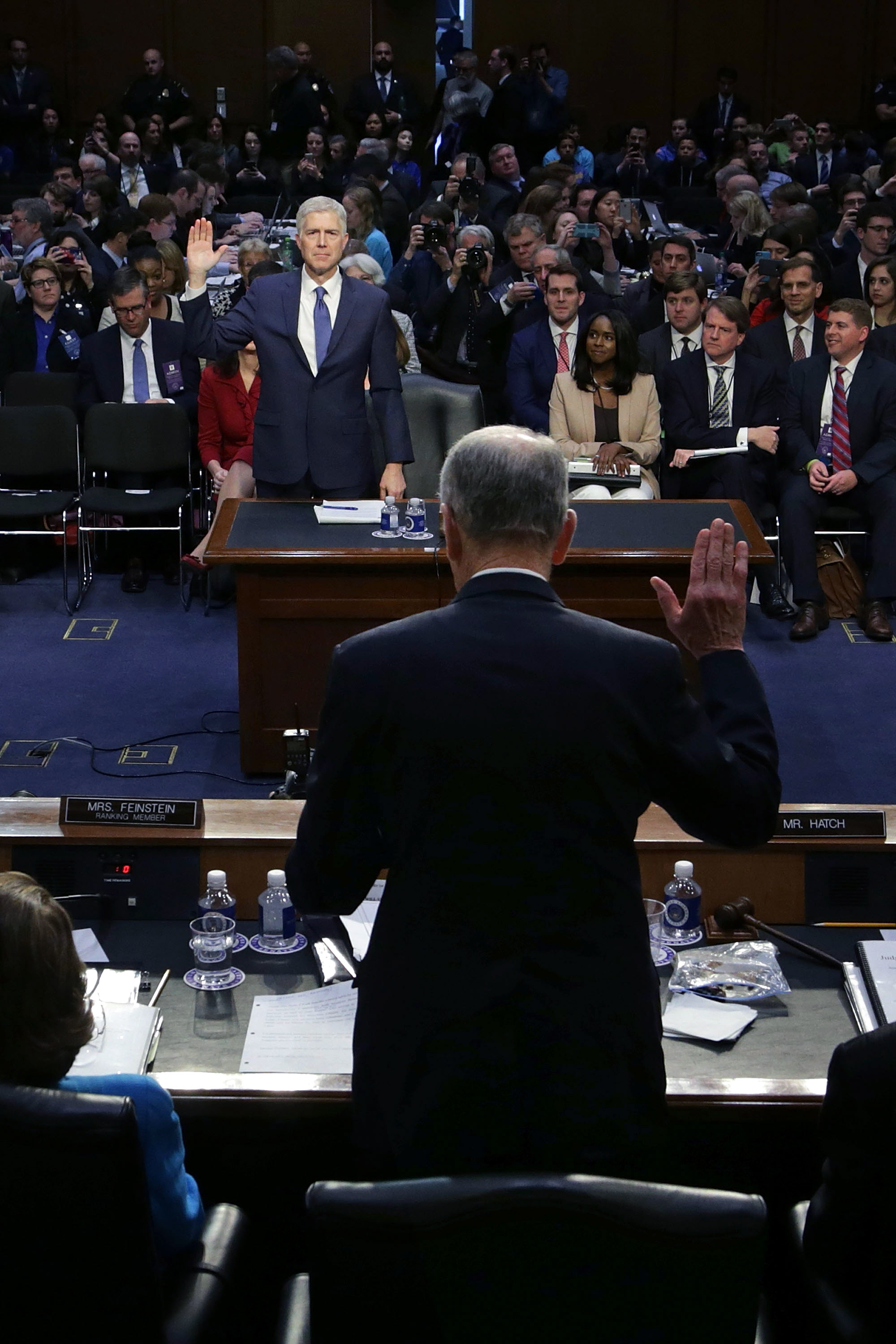 Senate Judiciary Committee Chairman Charles Grassley (R-Iowa) swears in Judge Neil Gorsuch during the first day of his Supreme Court confirmation hearing.