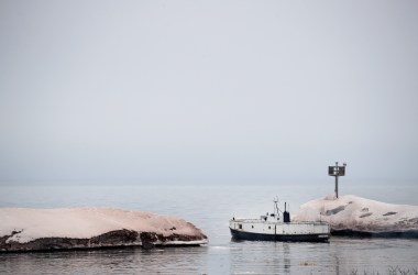 A fishing boat heads out to check nets on Lake Superior from Black River Harbor near Ironwood, Michigan, on March 27th, 2017.