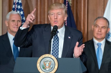 President Donald Trump speaks on March 28th, 2017, in Washington, DC. The order reverses the Obama-era climate change policies. US Vice President Mike Pence look on from left and EPA Administrator Scott Pruitt looks on from the right.