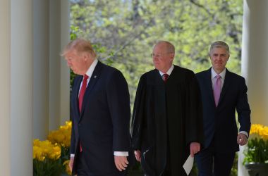 President Donald Trump, Justice Anthony Kennedy, and Neil Gorsuch make their way to the Rose Garden for Gorsuch's swearing-in ceremony as an associate justice of the U.S. Supreme Court at the White House on April 10th, 2017.