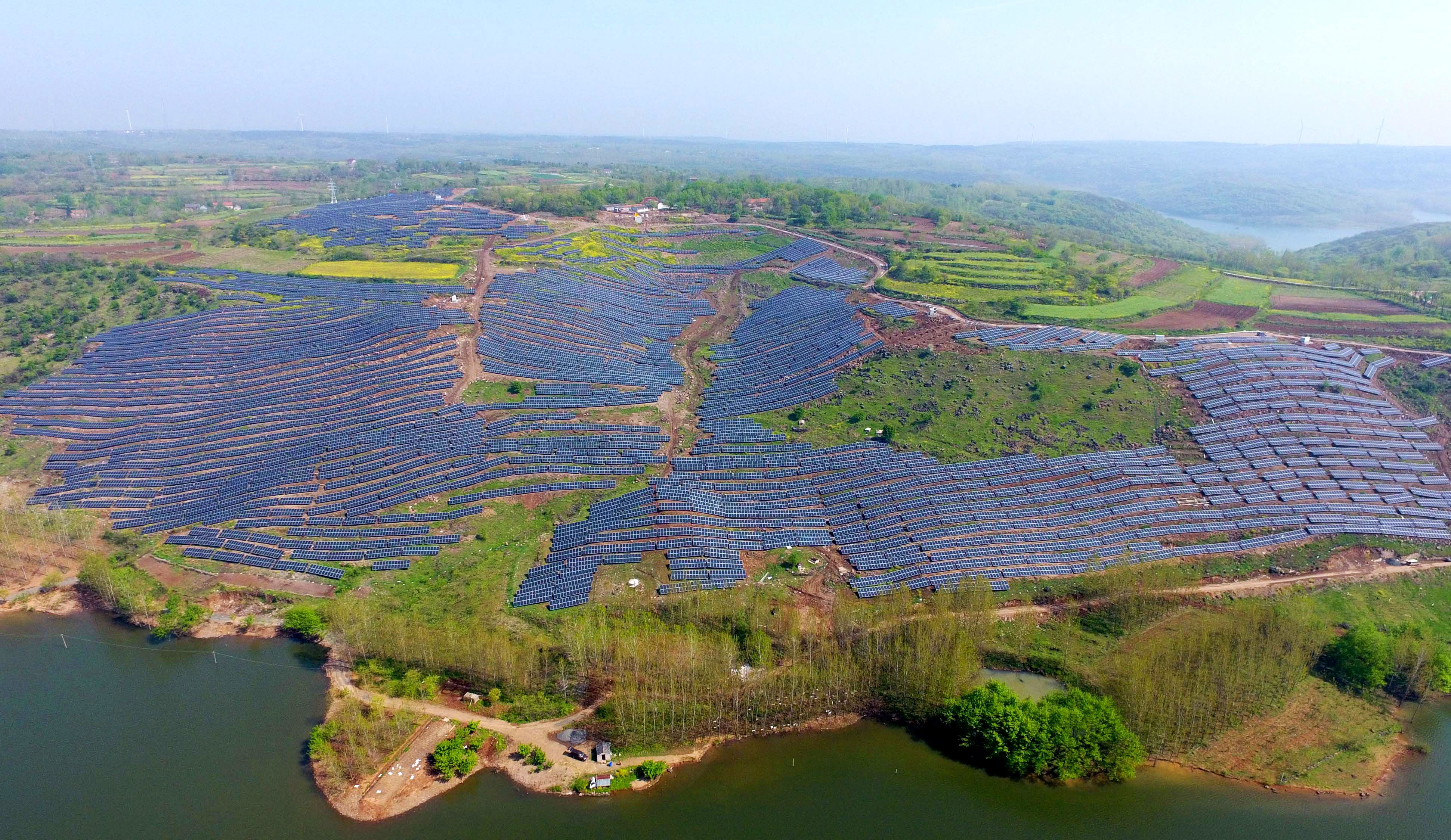 Solar photovoltaic modules on a hillside in a village in Chuzhou, in eastern China's Anhui province on April 13th, 2017.