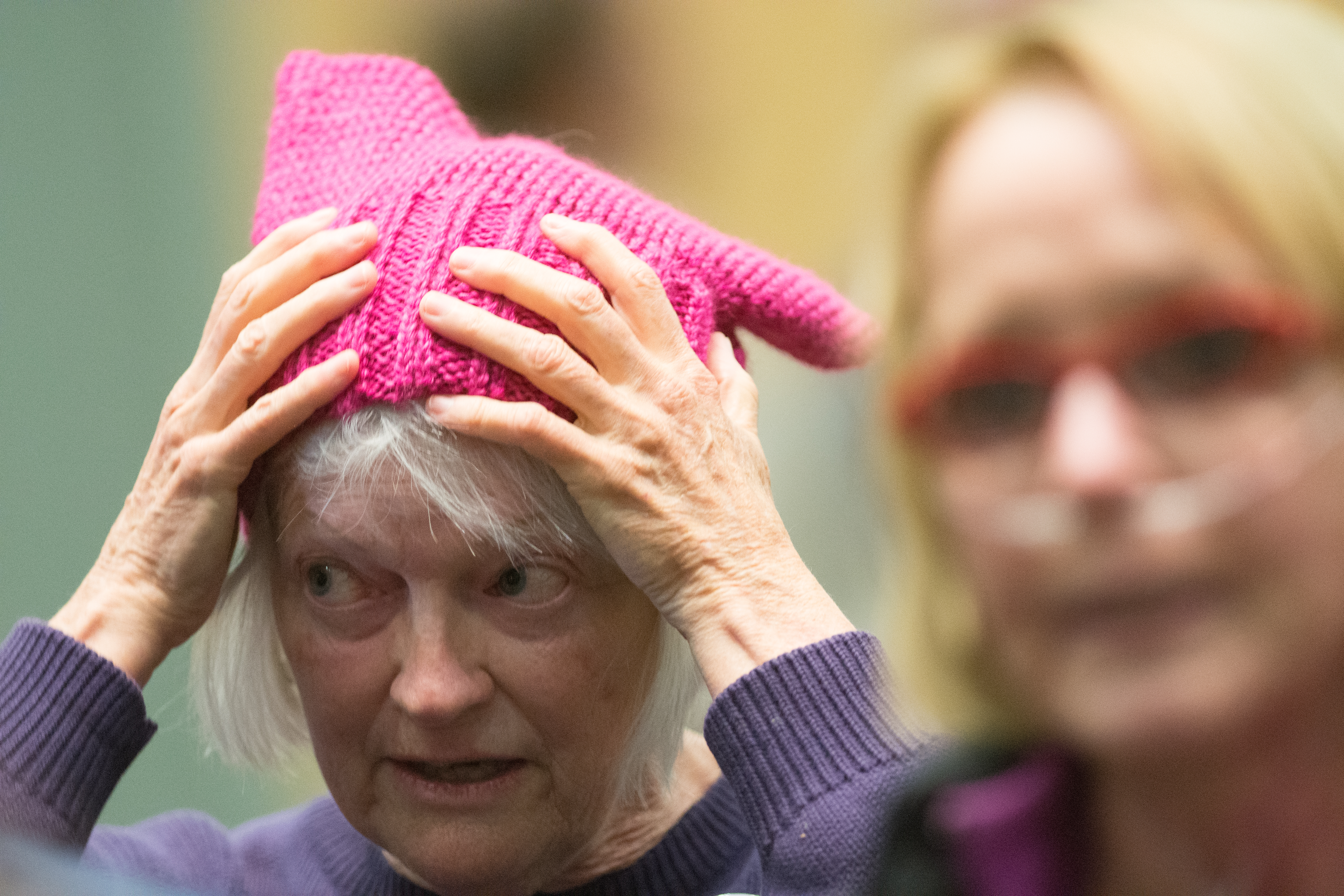 Barb Lentz adjusts her pink hat during a town hall meeting featuring Representative Mark Amodei (R-Nevada) on April 17th, 2017.