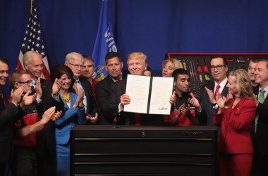 President Donald Trump signs an executive order to try to bring jobs back to American workers and revamp the H-1B visa guest worker program.