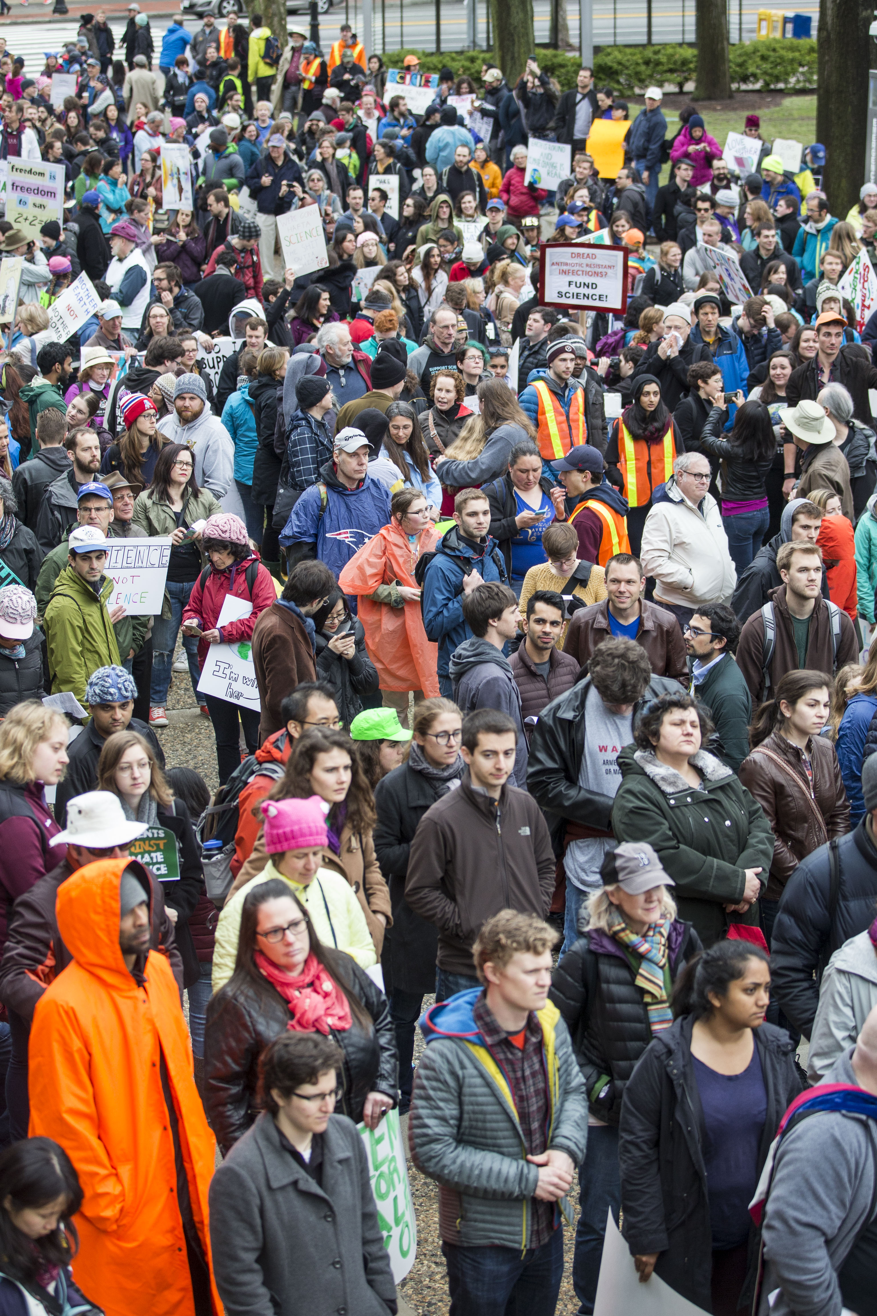 Community members from Harvard University and the Massachusetts Institute of Technology rally before marching to the Boston Common for the Science March on April 22nd, 2017.