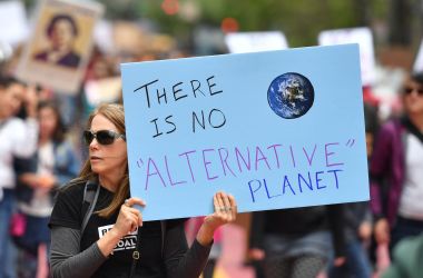 People hold signs during the March for Science in San Francisco, California, on April 22nd, 2017.