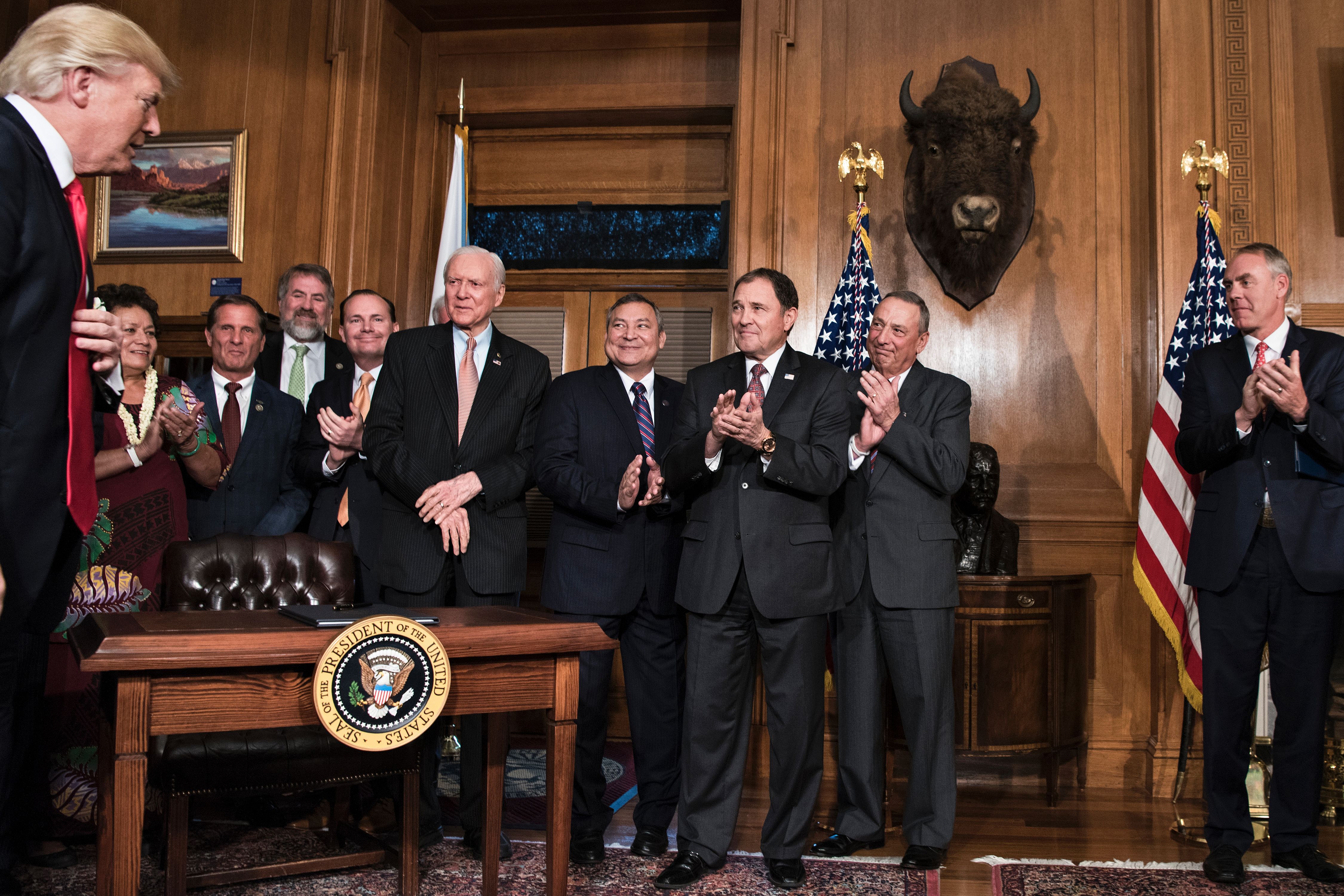 President Donald Trump arrives to sign an executive order to review the Antiquities Act at the Department of the Interior.