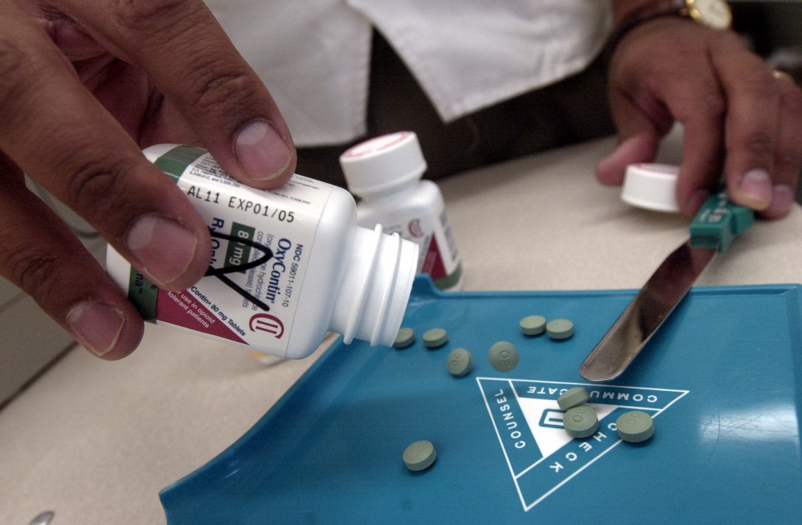 OxyContin being counted at a Walgreens drugstore on August 21st, 2001, in Brookline, Massachusetts.