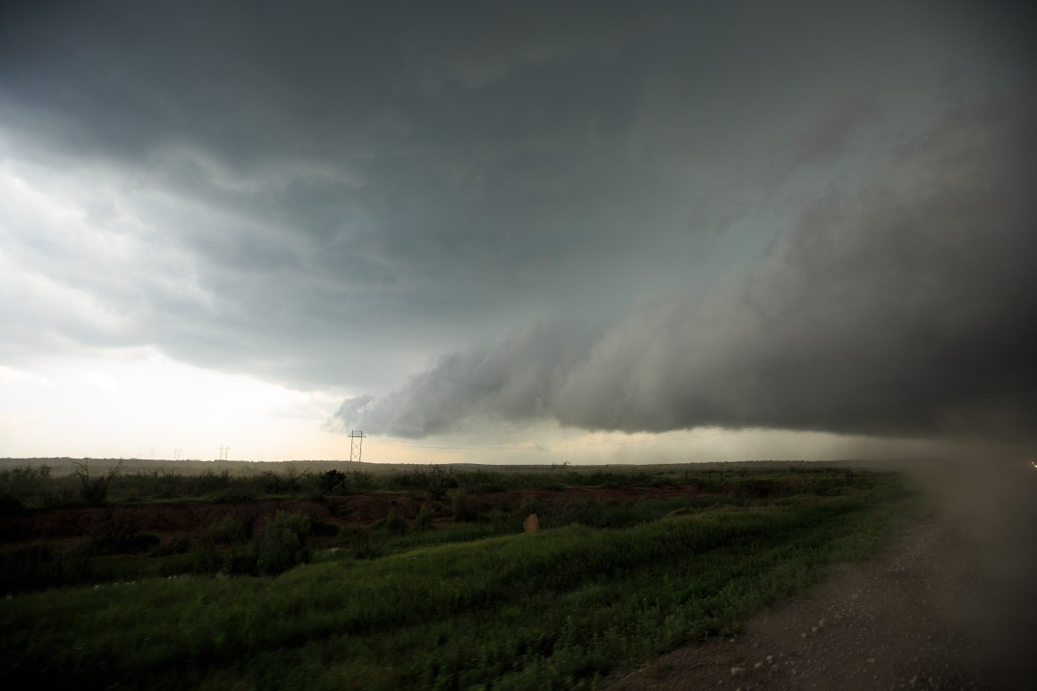 Viewed from the window of a tornado scout vehicle, a supercell thunderstorm develops on May 10th, 2017, in Olustee, Oklahoma.