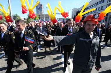 People carry flags and balloons during a rally in Donetsk on May 11th, 2017, to mark the third anniversary of a referendum on the declaration of the Donetsk People's Republic.