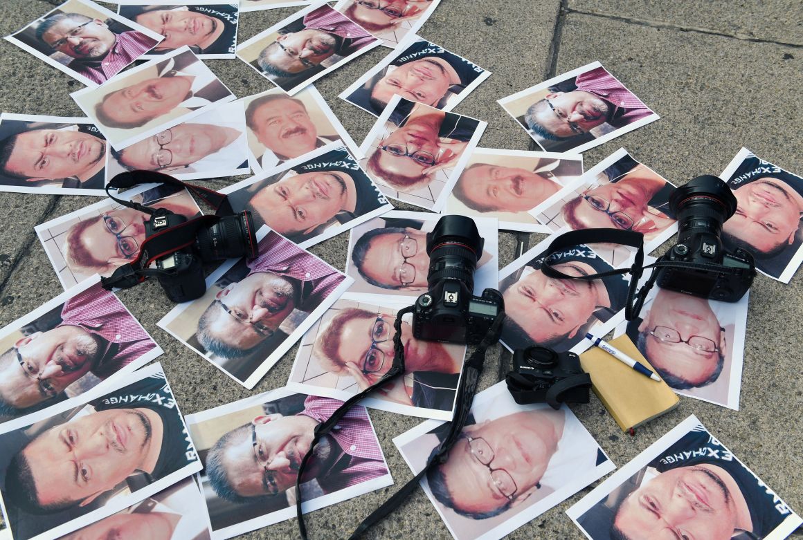 Cameras and pictures of journalists recently murdered in Mexico are placed at Independence Angel square during a protest in Mexico City on May 16th, 2017.