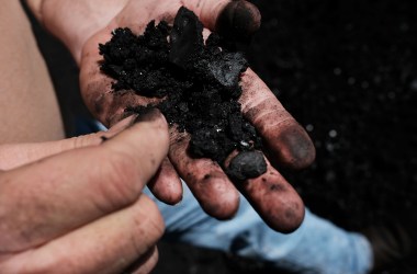 A worker handles coal at a plant outside the city of Welch, West Virginia, on May 19th, 2017.