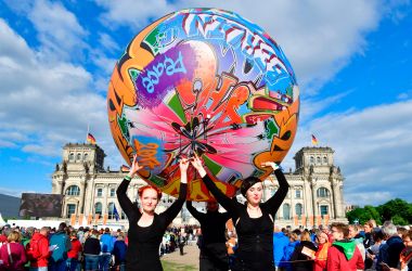 Performers carry a giant graffiti ball during the opening Mass of the Kirchentag (Church Day) festival in Berlin, Germany, celebrating the 500th anniversary of the Reformation, on May 24th, 2017.