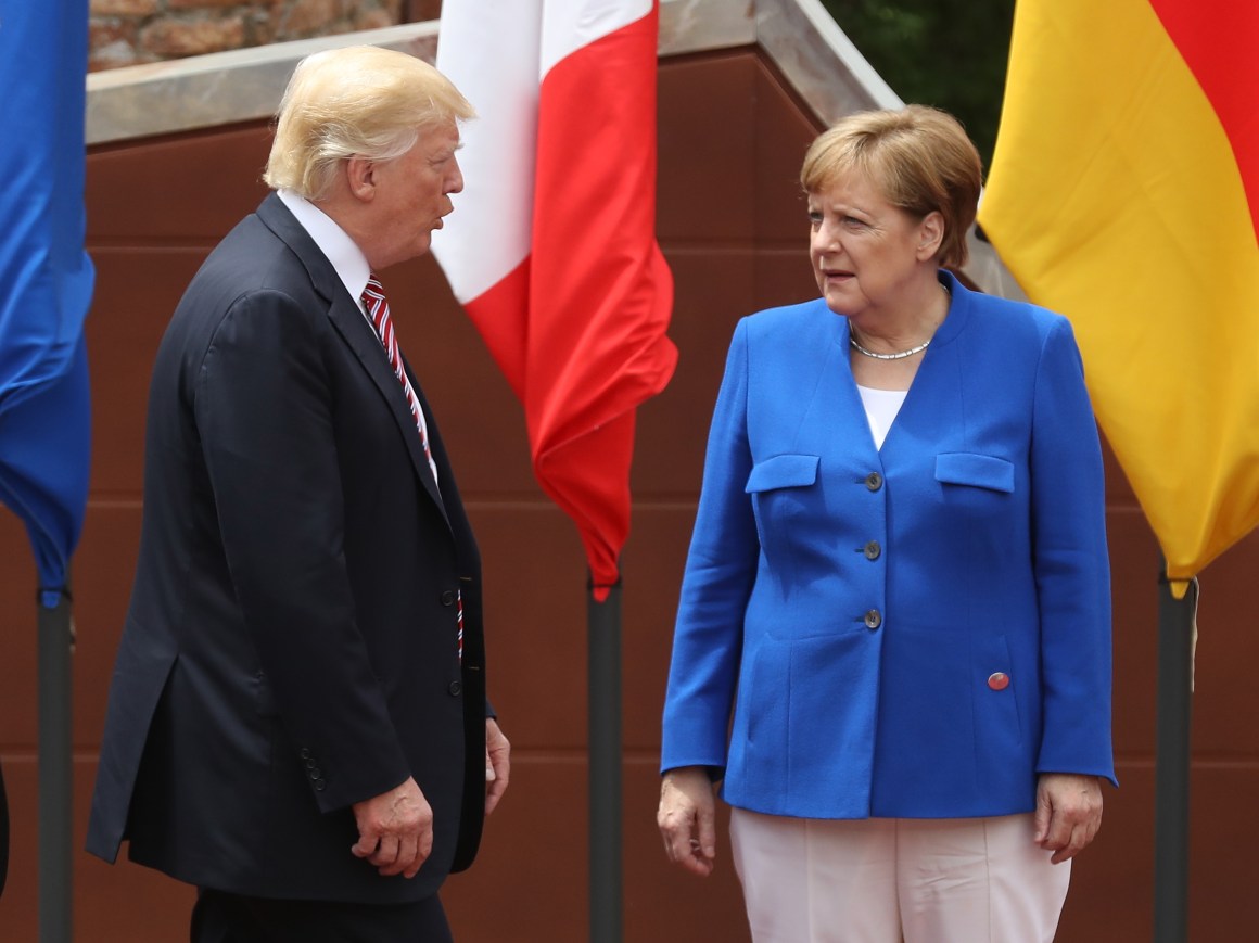 German Chancellor Angela Merkel and President Donald Trump arrive for the group photo at the G7 Taormina summit on the island of Sicily on May 26th, 2017.