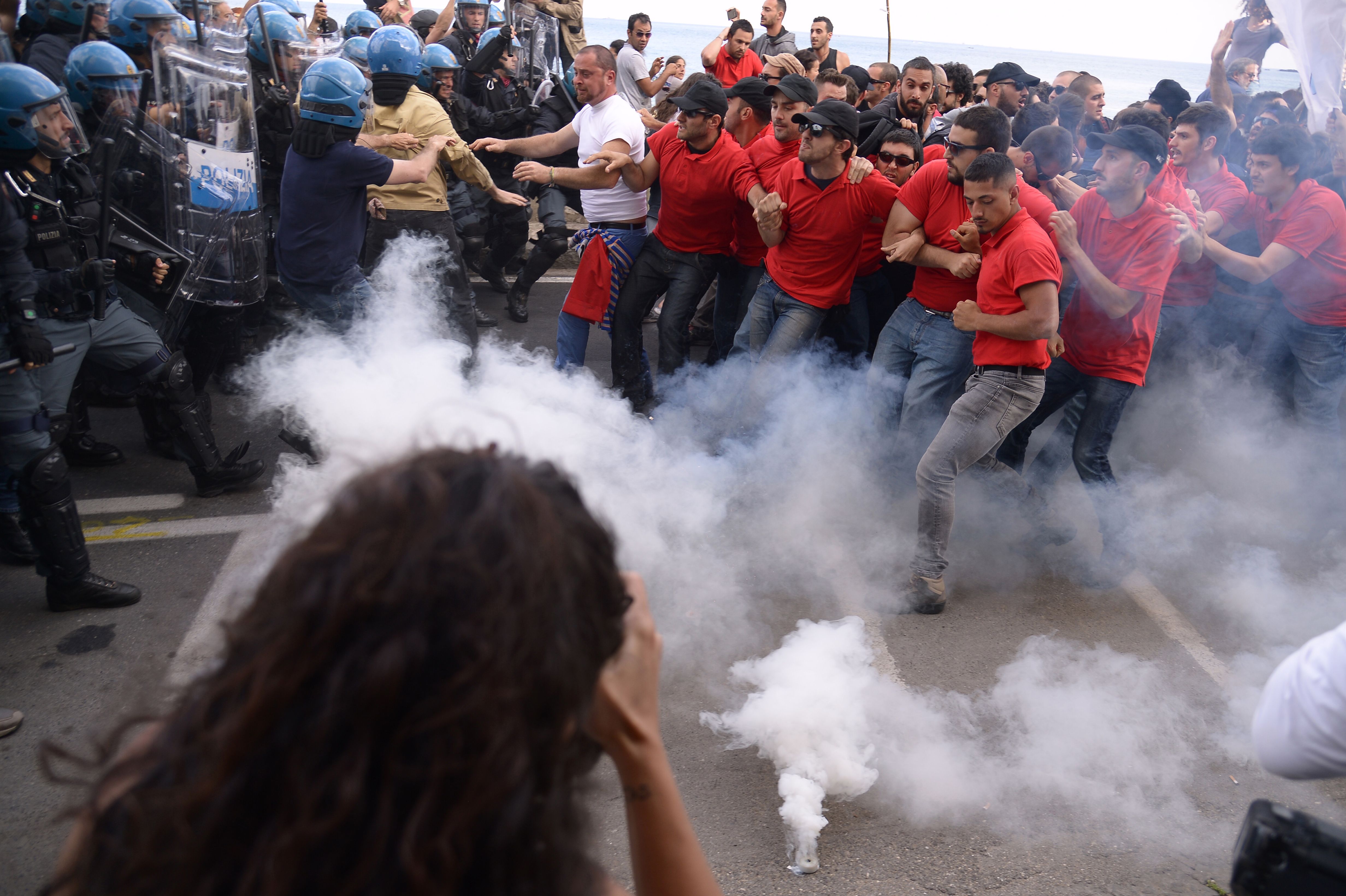 Protesters face anti-riot policemen during a rally against the G7 Summit in Giardini-Naxos in Sicily on May 27th, 2017.