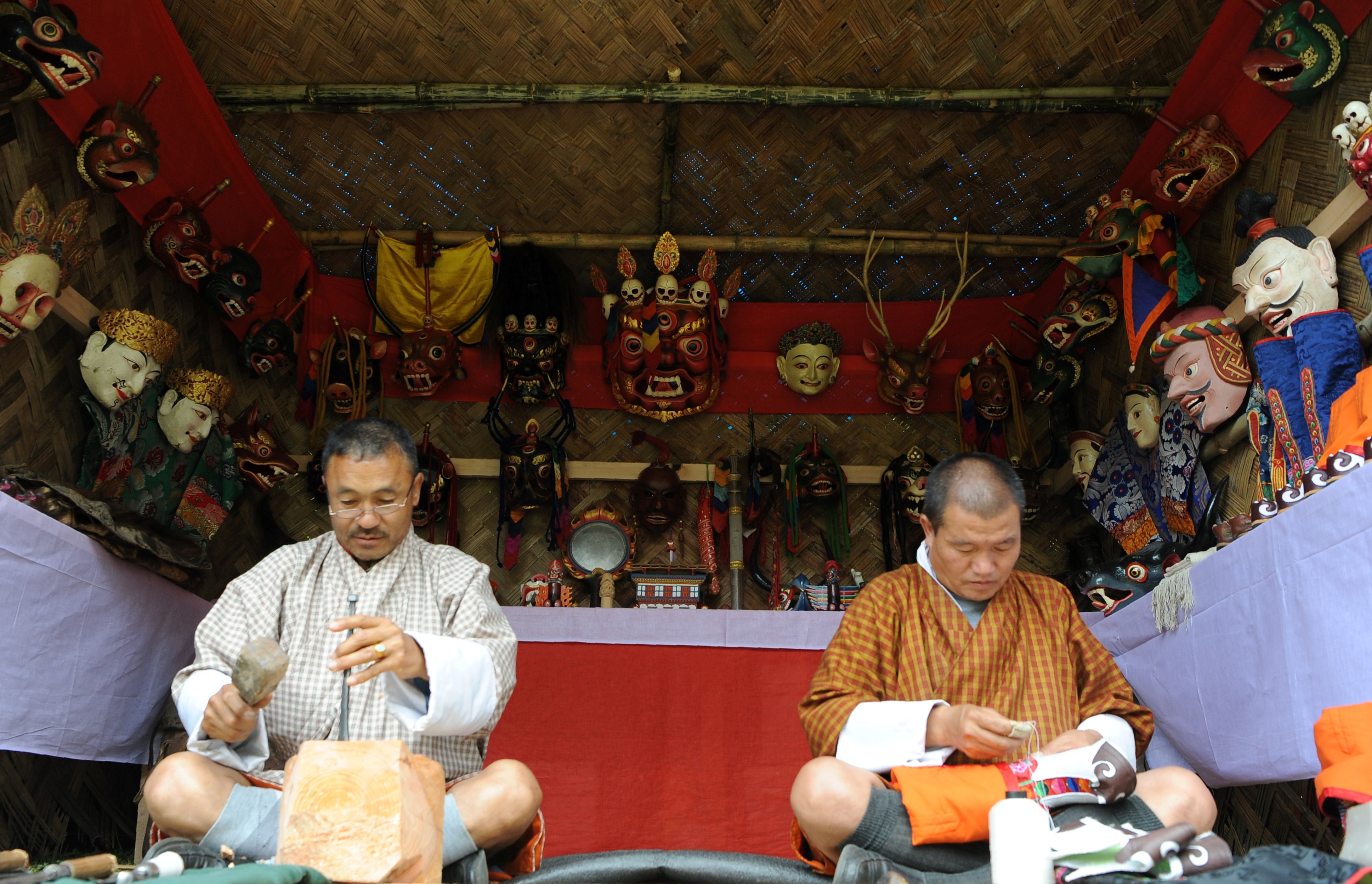 Bhutanese men prepare traditional shoes at a Folk Heritage Museum in Thimphu on June 1st, 2017, during a visit there by Japanese Princess Mako.