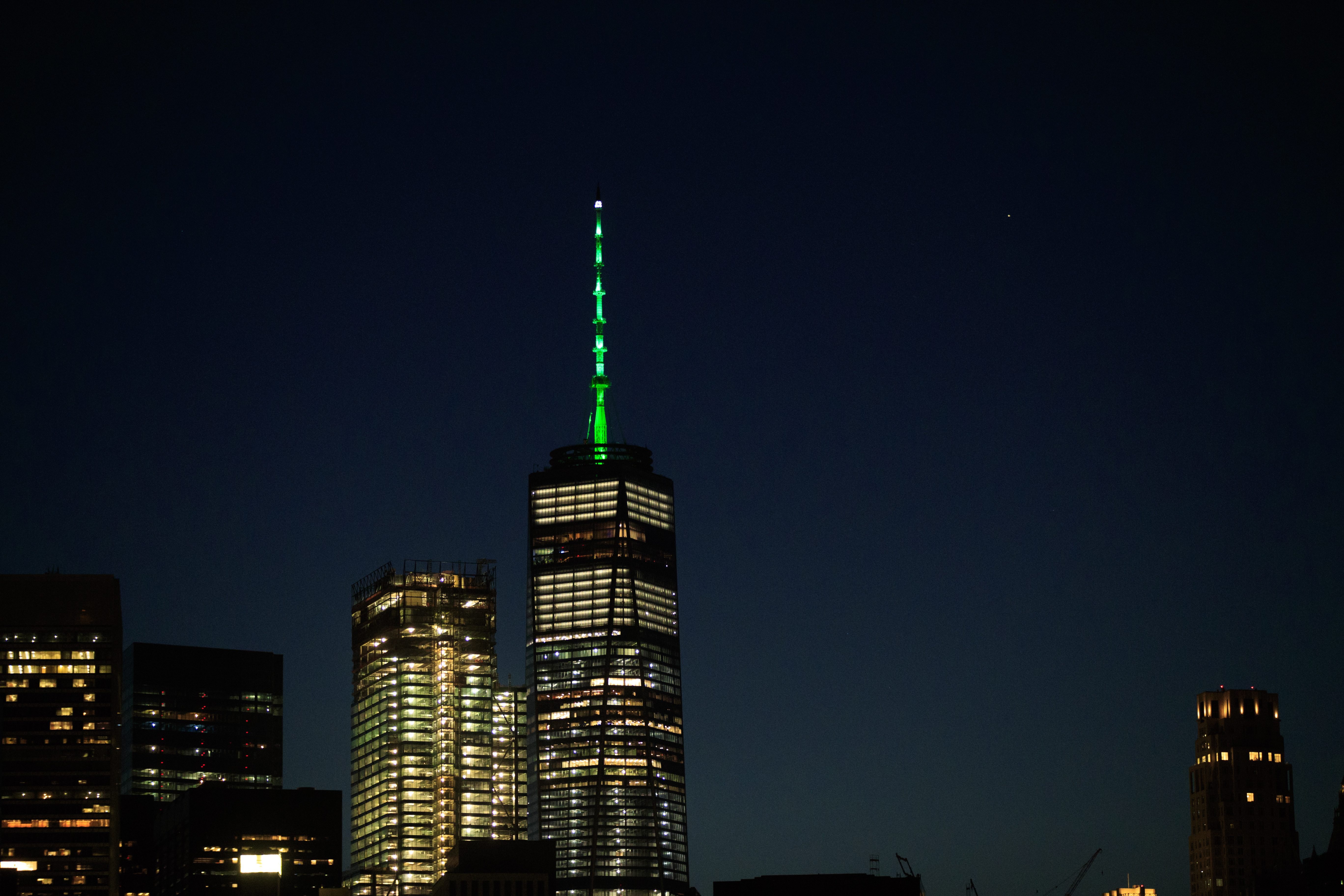 As directed by New York Governor Andrew Cuomo in response to President Trump's decision to pull the United States out of the Paris Agreement, One World Trade Center is illuminated with green light in New York City on June 1st, 2017.